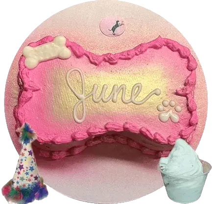 Pink dog cake with "June" decoration.