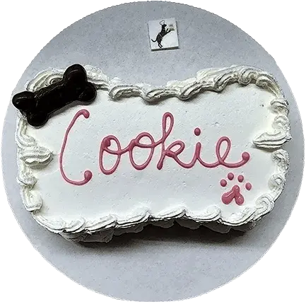 Dog-themed cake with "Cookie" written on it.