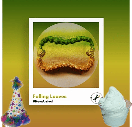 Multicolored pastry with party hat and ice cream.