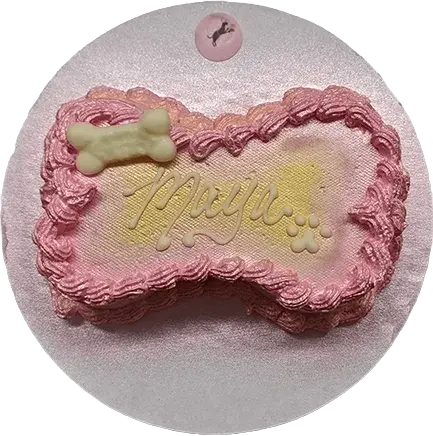 Pink dog cake with bone decoration.