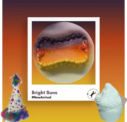 Colorful dessert with party hat and ice cream.