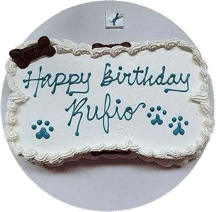 Dog birthday cake with paw prints decoration.