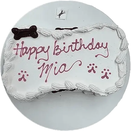 Dog-themed birthday cake with "Happy Birthday Mia.