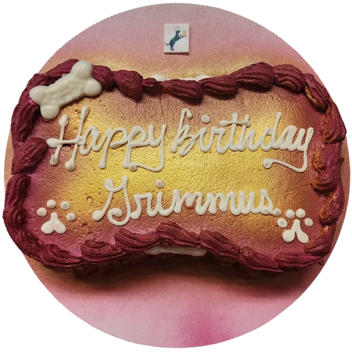 Dog-themed birthday cake with paw prints.