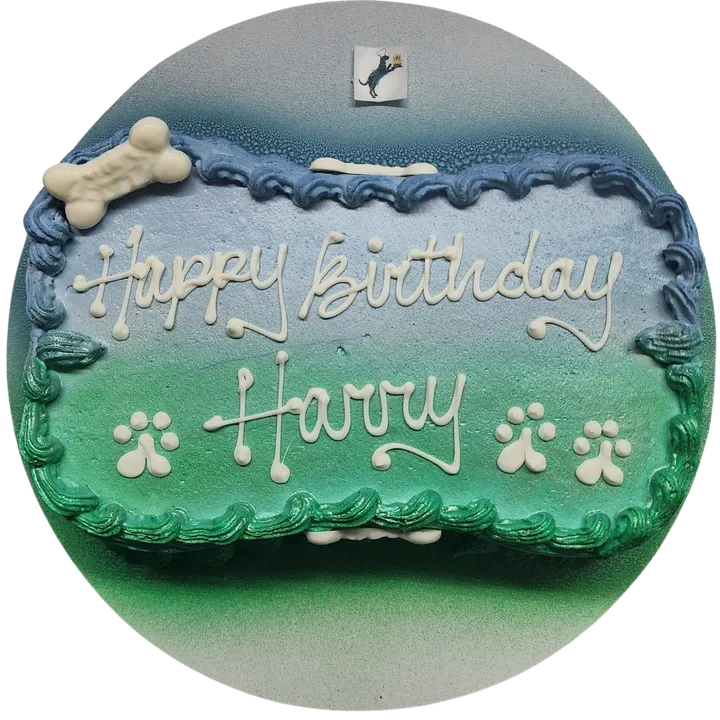 Dog-themed birthday cake with paw prints.