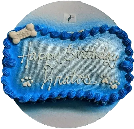 Blue dog-themed birthday cake with paw prints.