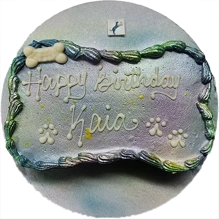 Dog-themed birthday cake with paw prints.
