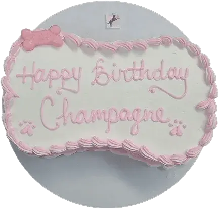 Dog bone-shaped cake with pink icing.