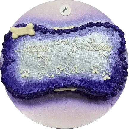 Purple bone-shaped cake with birthday message.