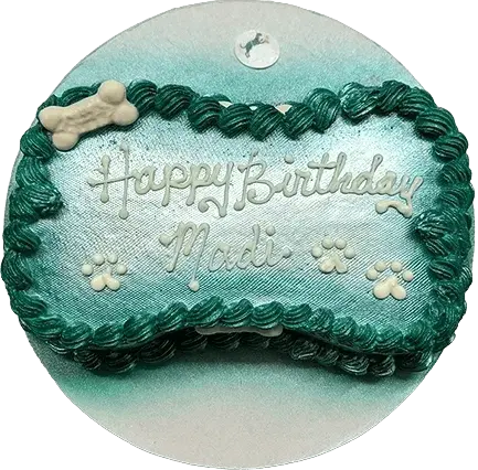 Teal dog birthday cake with bone decoration.