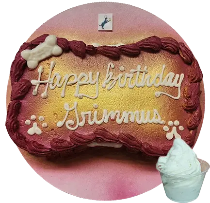 Dog-themed birthday cake with ice cream.