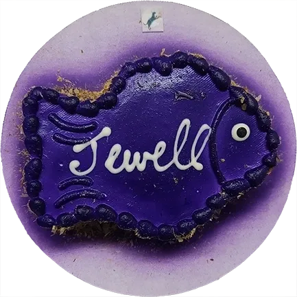 Purple fish-shaped cookie with "Jewell" text.