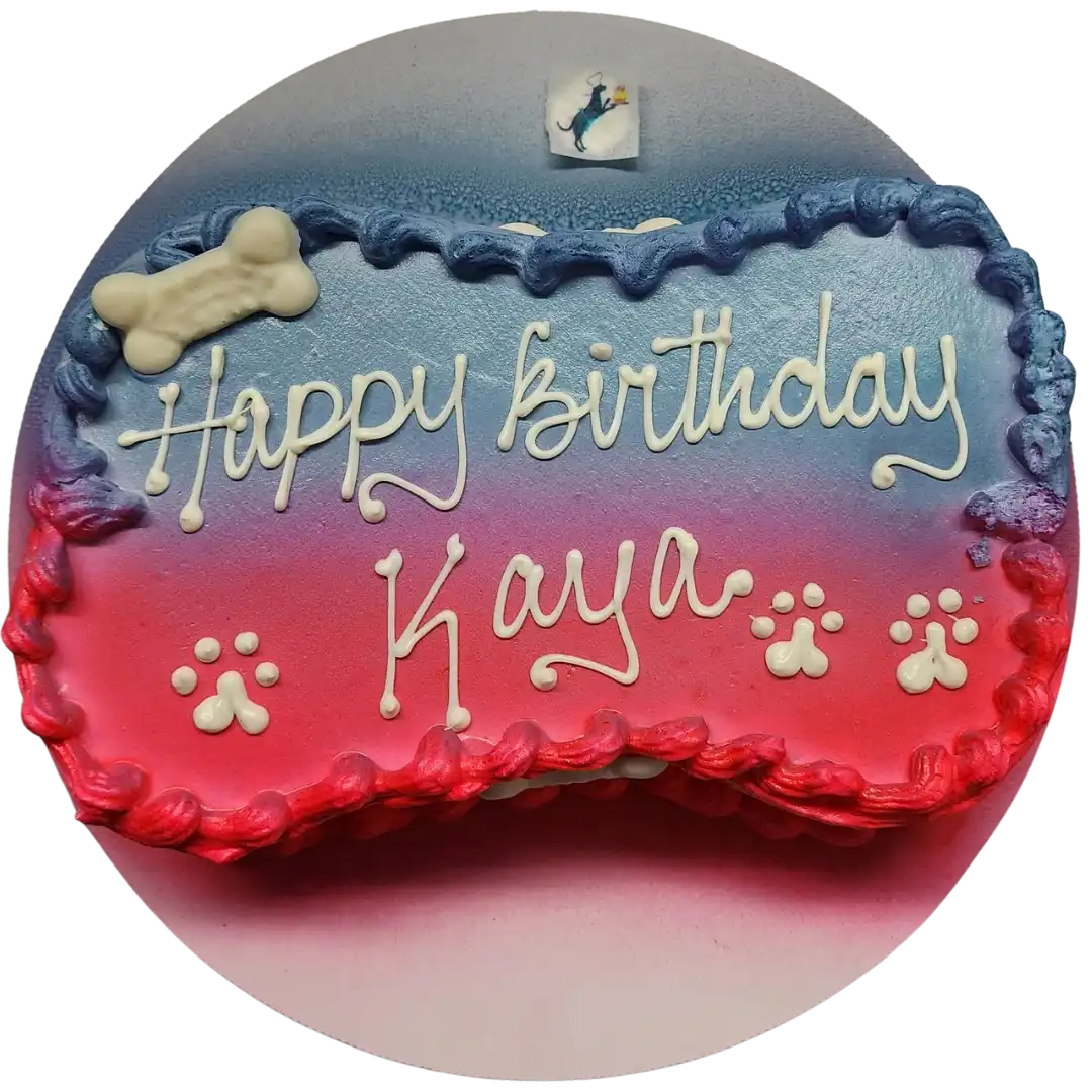 Dog-themed birthday cake with paw prints.