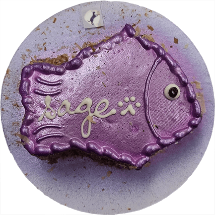 Purple fish-shaped cake with "Sage" decoration.