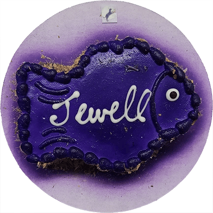 Purple fish-shaped cookie with "Jewell" text.