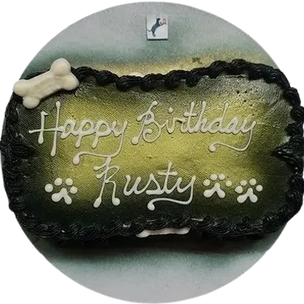 Dog-themed birthday cake with "Happy Birthday Rusty".