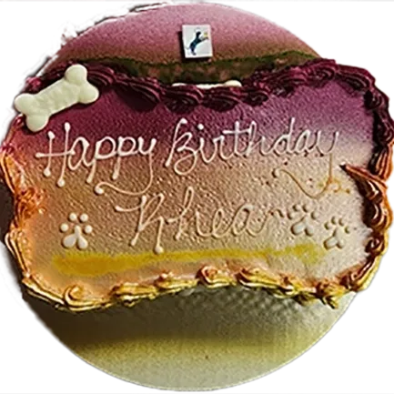 Birthday cake with paw prints and bone.