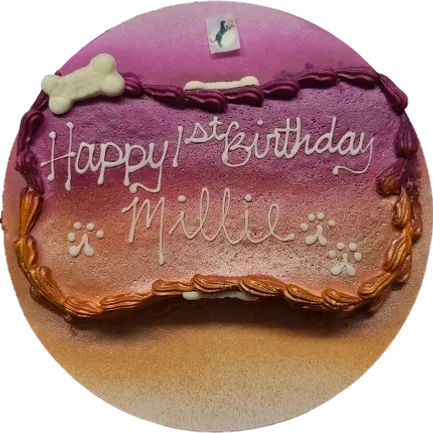 Dog-themed birthday cake with paw prints.
