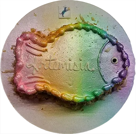 Fish-shaped rainbow cake on round platter