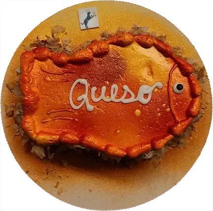 Fish-shaped cake with "Queso" icing