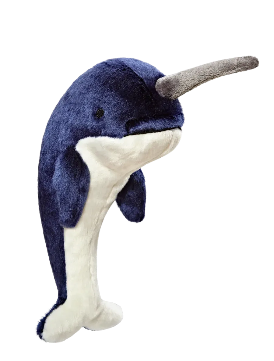 Cute narwhal plushie on black background