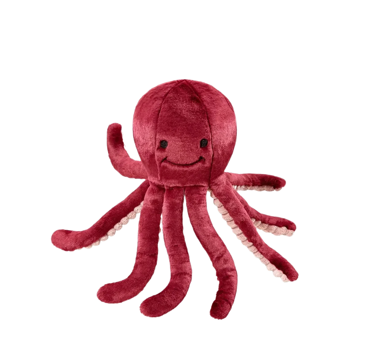 Red plush octopus toy on black background.