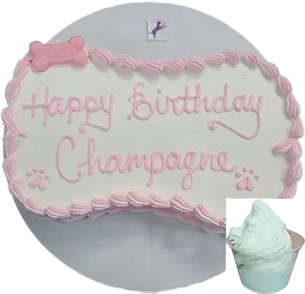 Dog birthday cake with pink icing decoration.