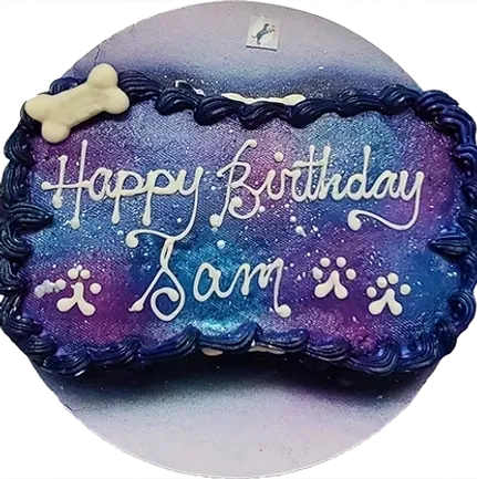 Dog birthday cake with paw prints decoration.
