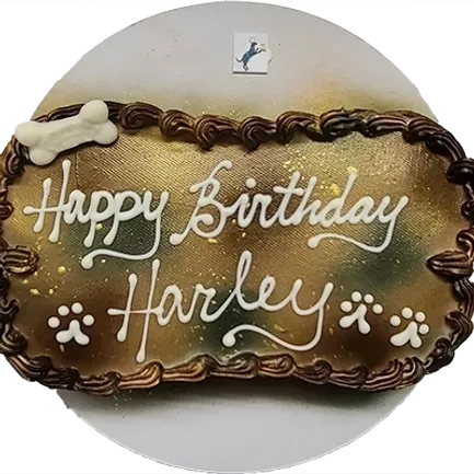 Dog-themed birthday cake with "Happy Birthday Harley.
