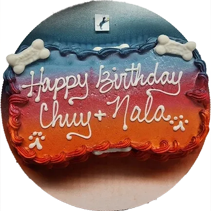 Colorful birthday cake with dog bone decorations.