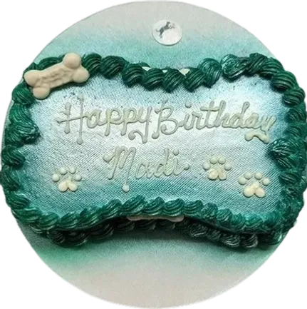 Dog-themed birthday cake with paw prints.