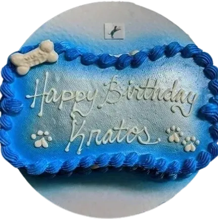 Blue birthday cake with bone decoration.