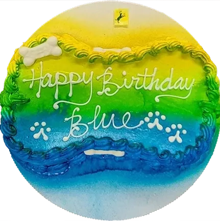 Colorful birthday cake with paw prints decoration.