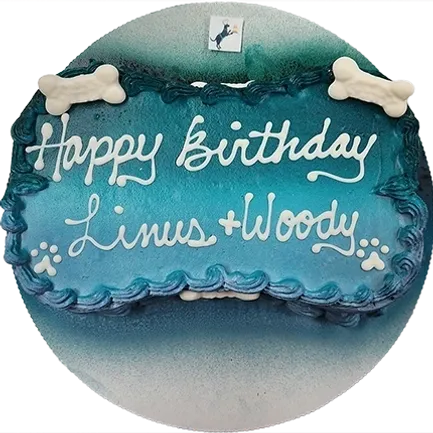 Blue dog bone cake with birthday message.