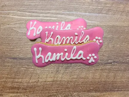 Pink dog bone cookies with name