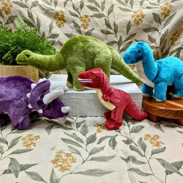 Colorful dinosaur plush toys on display