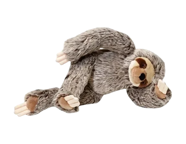 Stuffed sloth toy on black background.