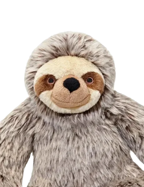 Stuffed sloth toy on black background.