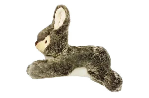 Plush rabbit toy on black background.