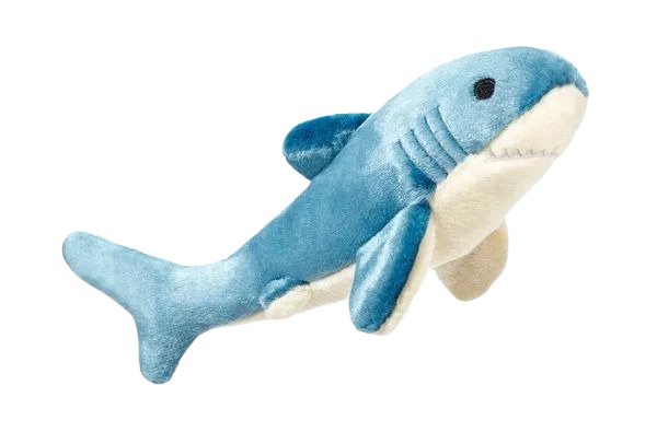 Blue shark plush toy on black background.
