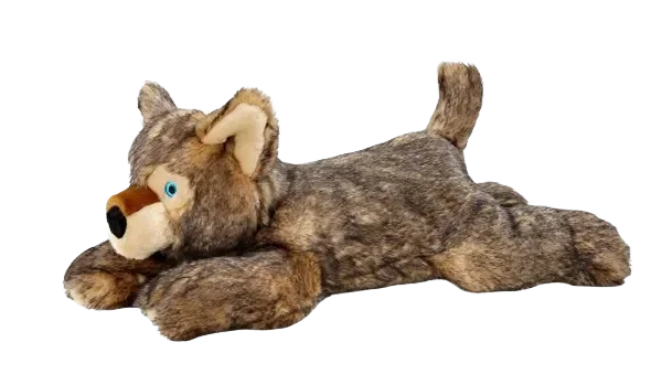 Plush wolf toy on black background.
