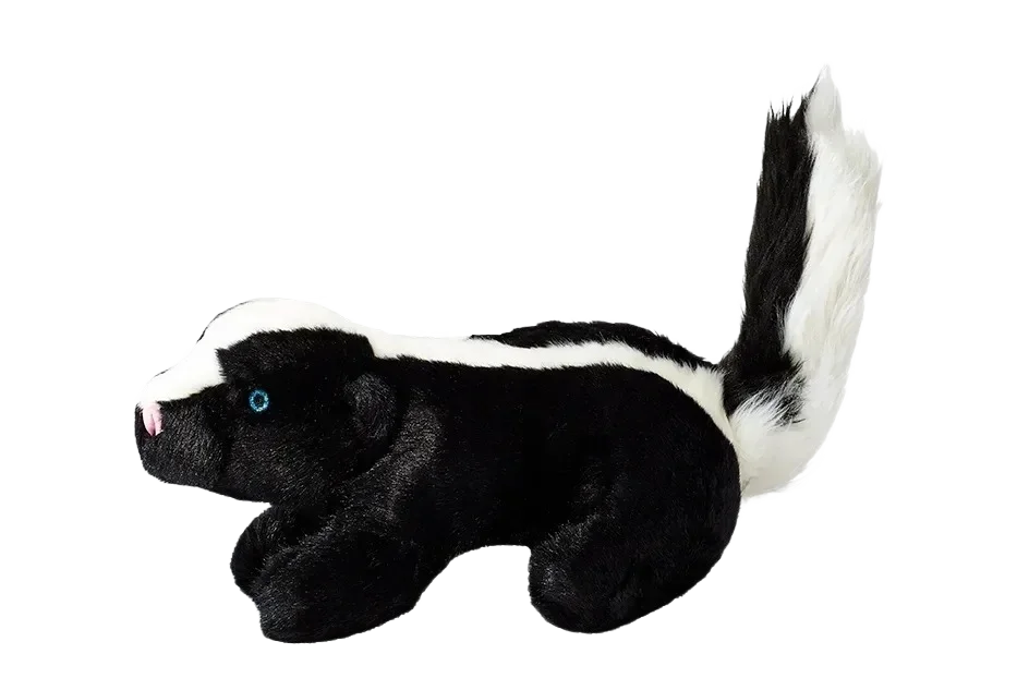 Plush skunk toy against a black background.