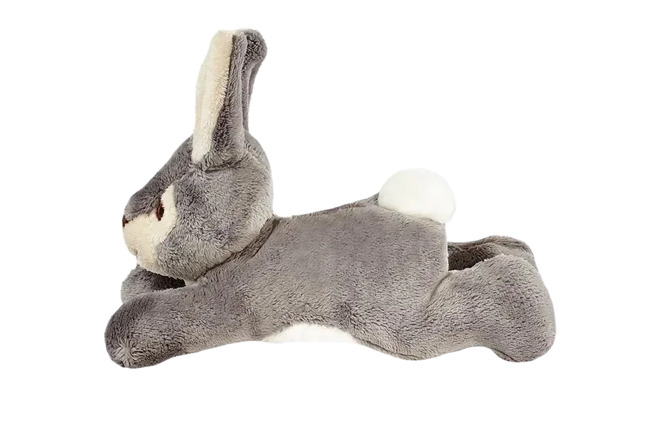Gray plush bunny on black background.