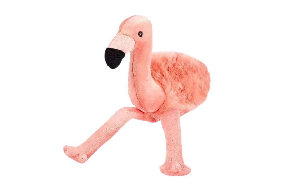 Pink flamingo plush toy on black background.