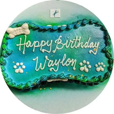 Blue and green dog-themed birthday cake
