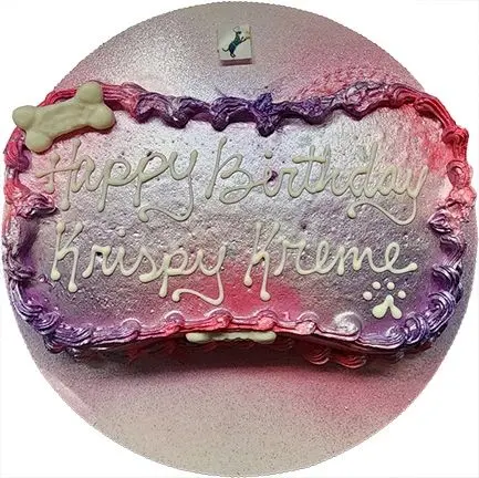 Pink and purple dog cake with paw prints