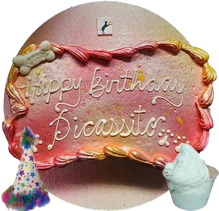 Dog birthday cake with party hat and treat