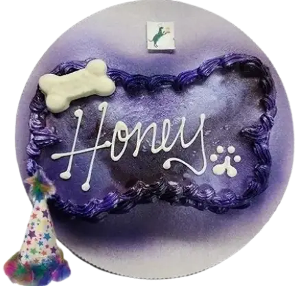 Purple dog birthday cake with "Honey