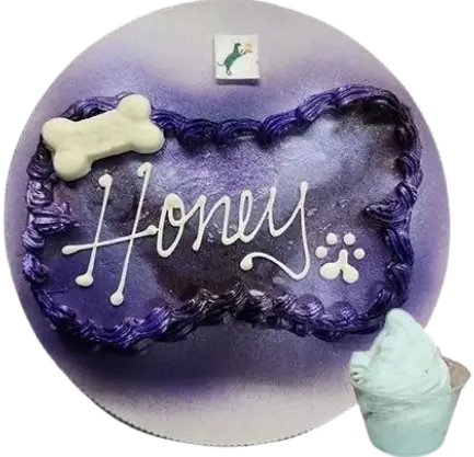 Purple dog cake with "Honey